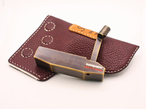 Milled putter with leather headcover by Deschamps designs golf