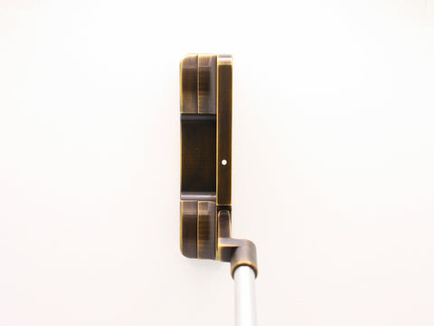 Putter at address by Deschamps Designs Golf