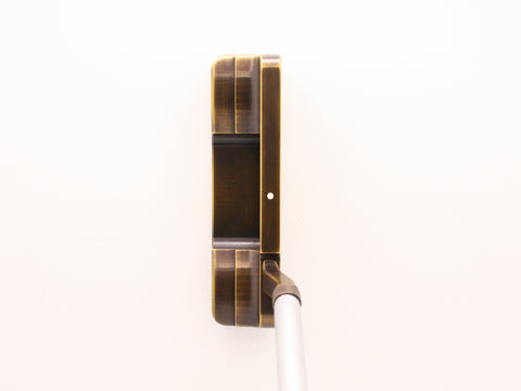 Left handed putter with site dot at address