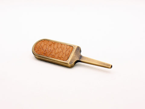 Milled divot tool with beaver tail inlay