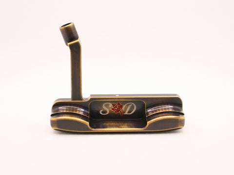 Milled putter with rounded bumpers